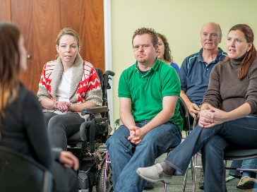 A group of people having a meeting.