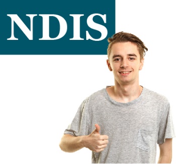 A person giving a thumbs up in front of a sign that says 'NDIS'.
