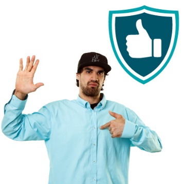 A person with disability pointing to themselves and raising their other hand. They are standing next to a safety icon with a thumbs up in it. 
