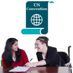 Two people looking over a document. Above is an icon of the United Nations Convention on the Rights of Persons with Disabilities. 